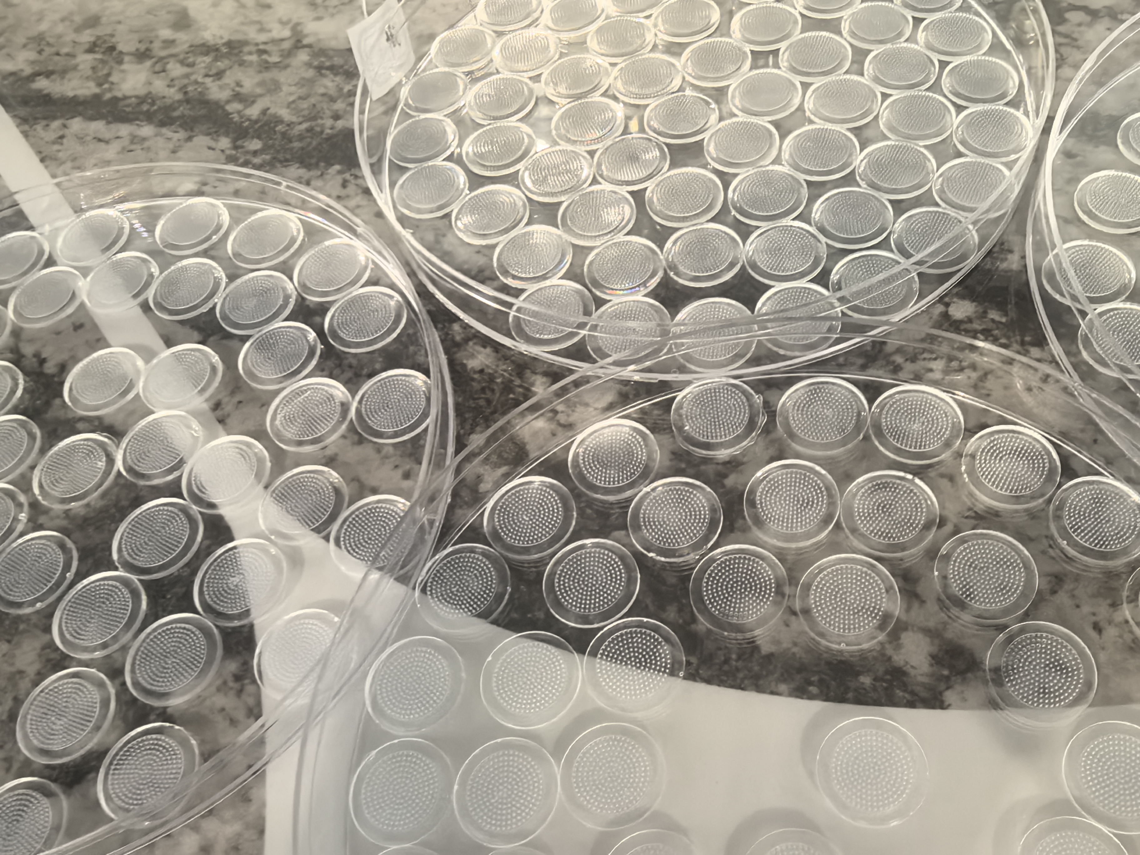 Circular microarray components in production trays