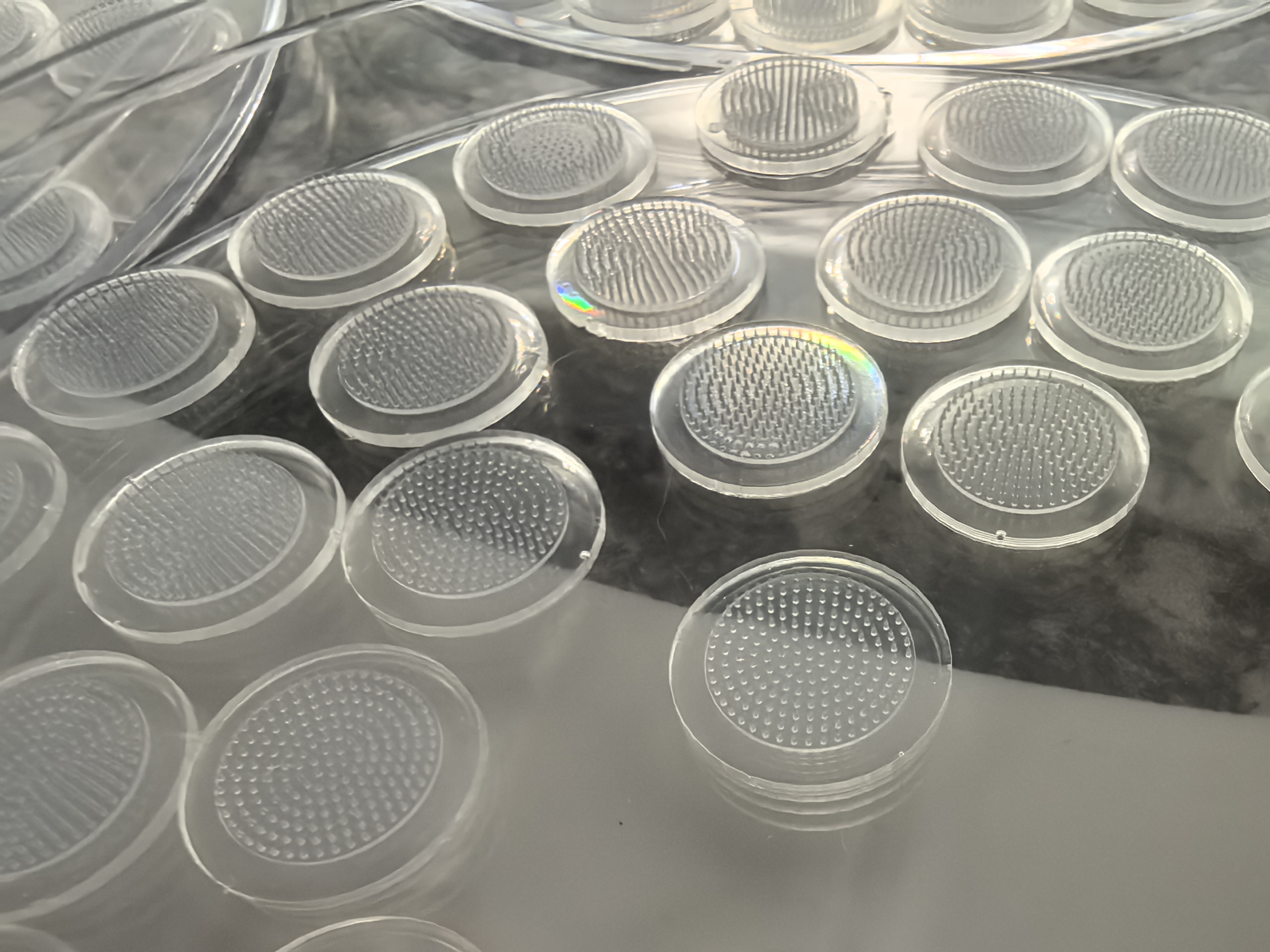 Microneedle patch trays photographed during manufacturing